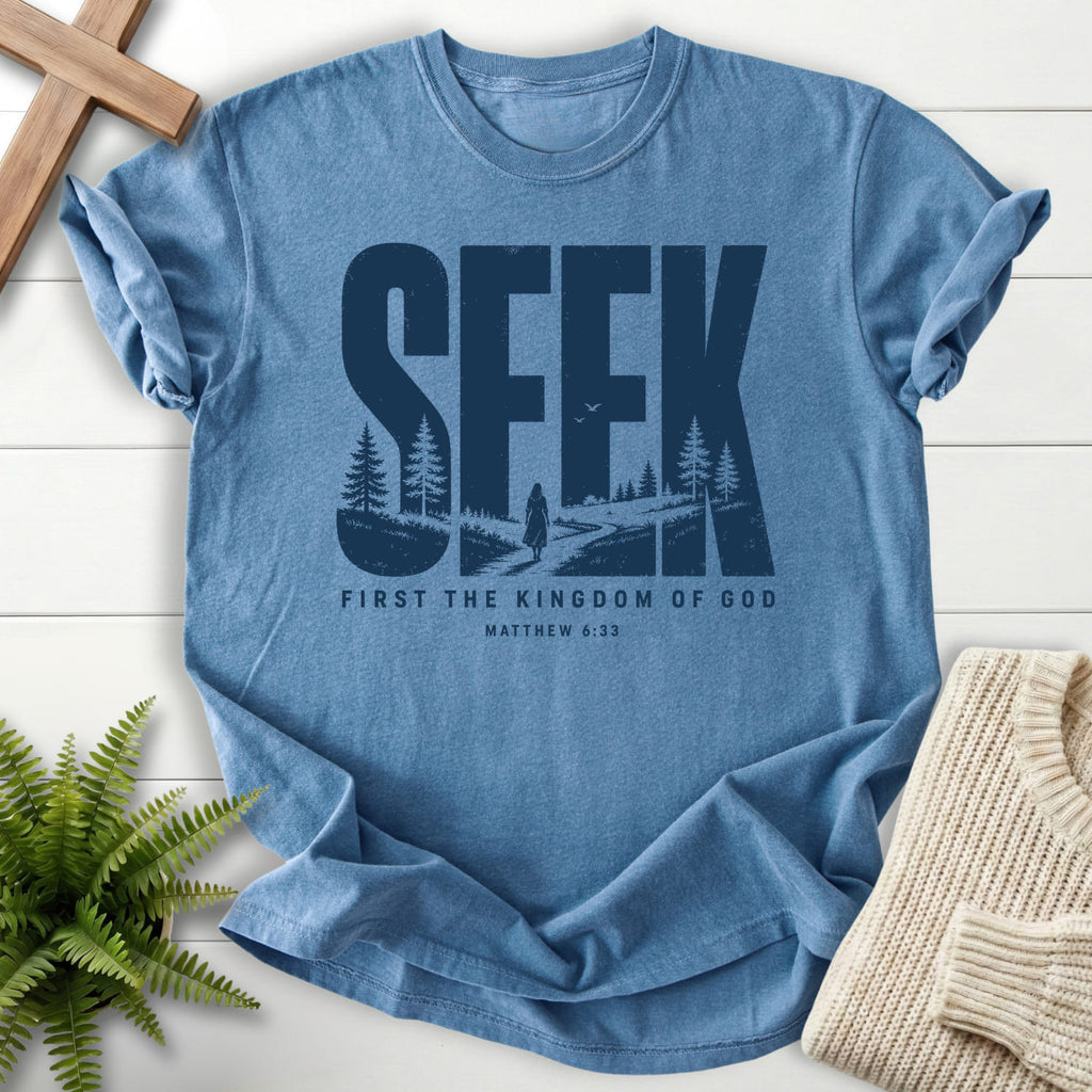 Flatlay of a Blue Jean women's Christian tee with "Seek First the Kingdom of God T-Shirt" Matthew 6:33.