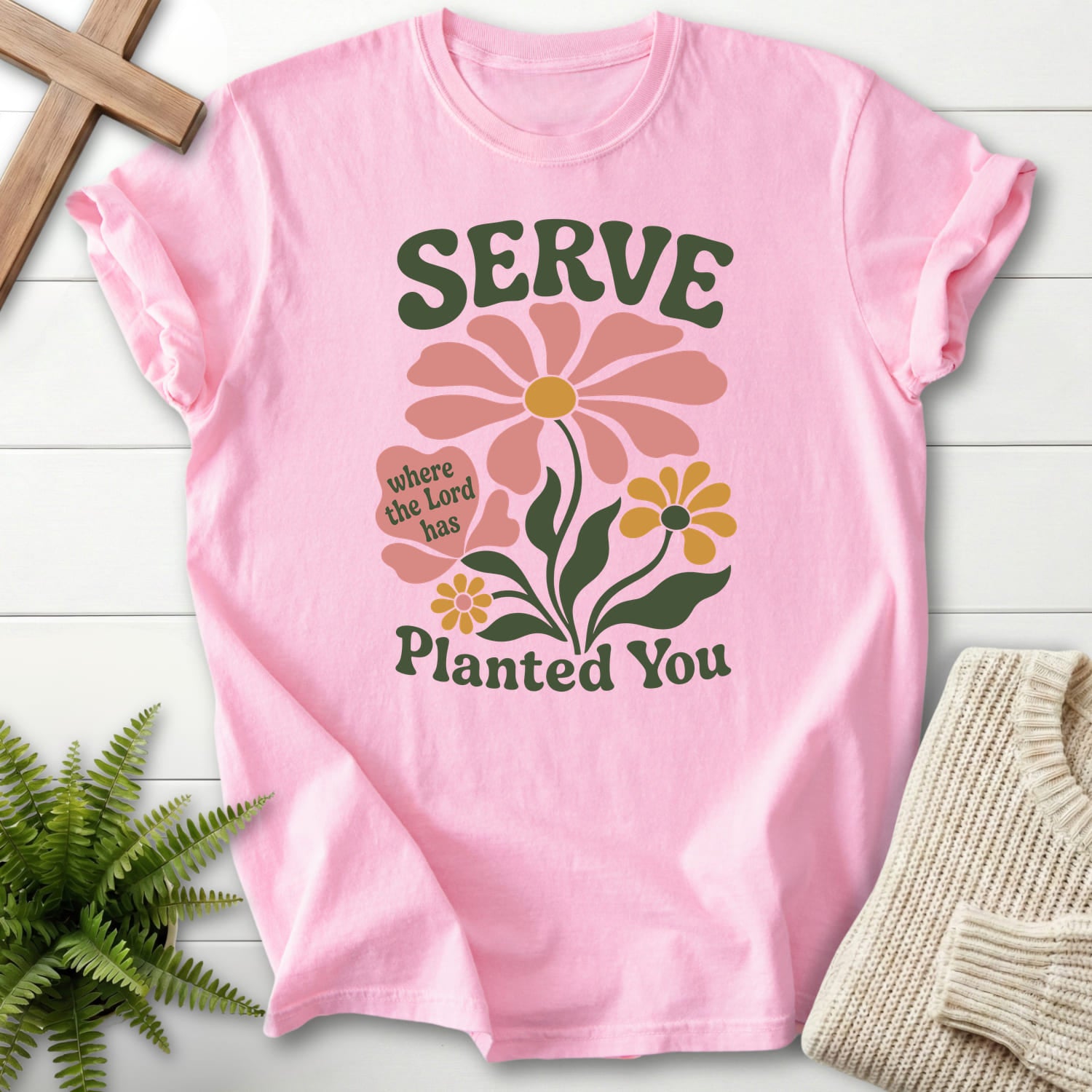 Flatlay of a Blossom Comfort Colors 1717 Christian t-shirt for women with floral line art with "Serve Where You Are Planted T-Shirt" From Printify.