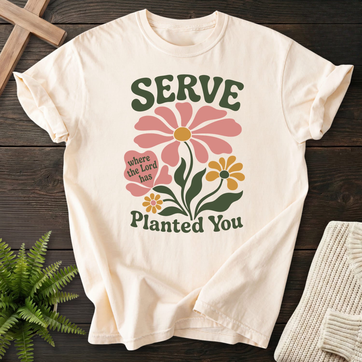 Flatlay of an Ivory Comfort Colors 1717 garment-dyed Christian tee with floral line art with "Serve Where You Are Planted T-Shirt".