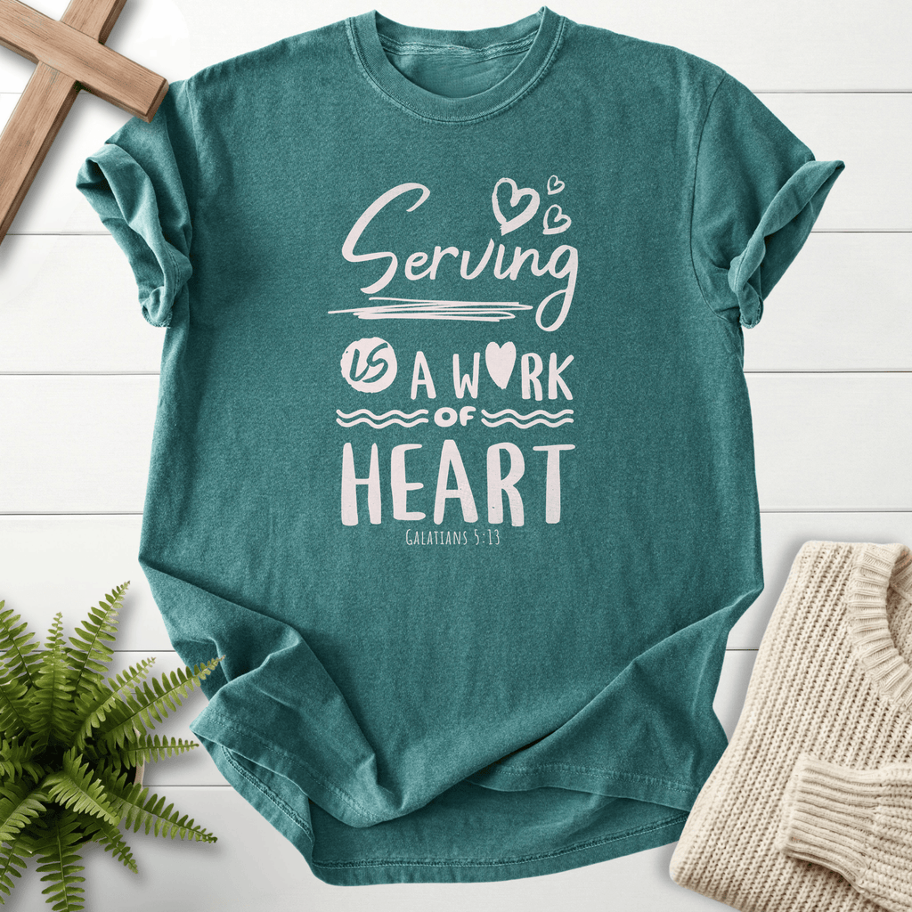 Blue Spruce women's Christian t-shirt with "Serving is a Work of Heart" lettering, inspired by Galatians 5:13.