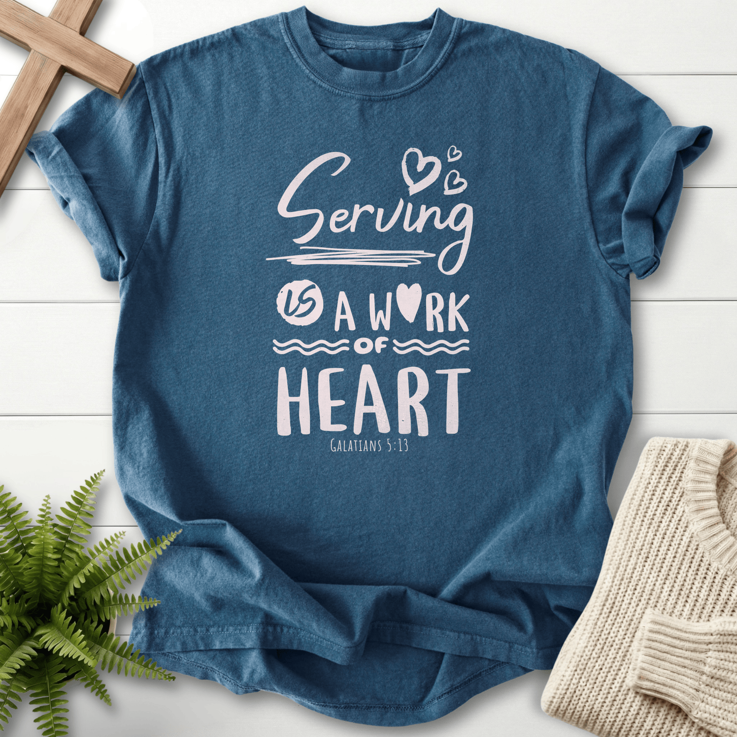 Midnight women's Christian t-shirt with "Serving is a Work of Heart" and heart accents, inspired by Galatians 5:13.