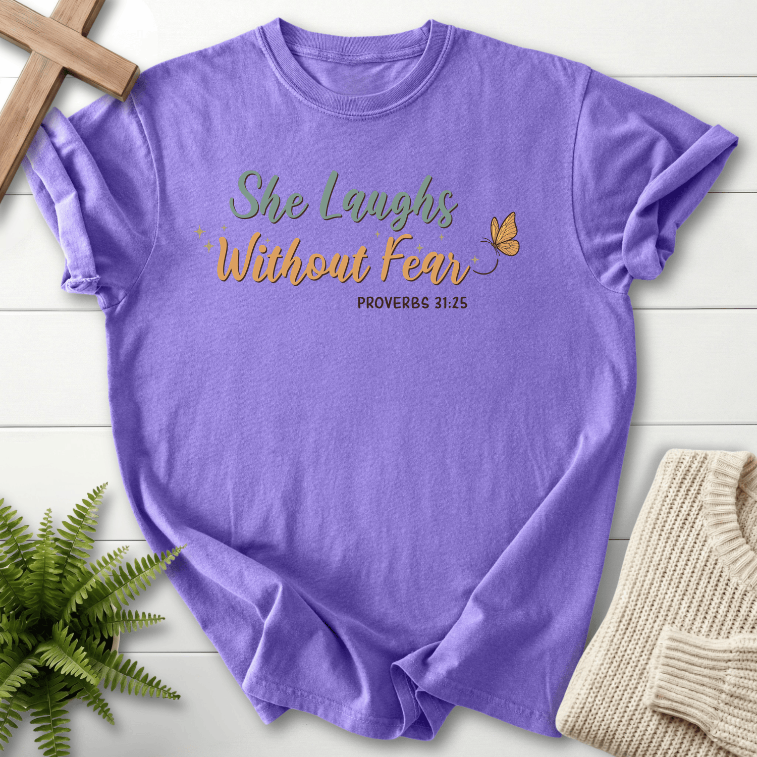 Violet women's Christian t-shirt with "She Laughs Without Fear" script, inspired by Proverbs 31:25.