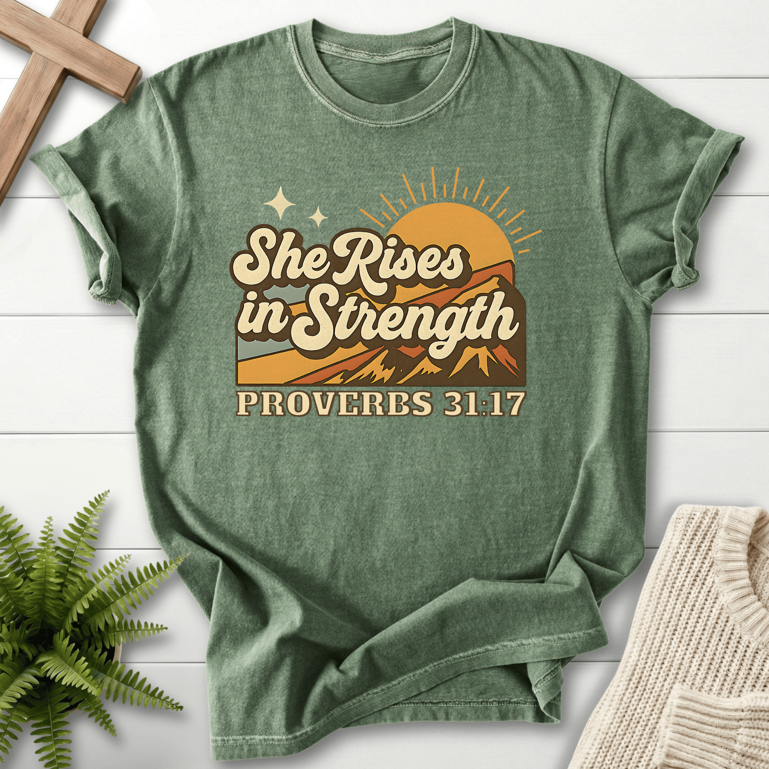 Moss women's Christian t-shirt with retro mountain sunrise design, inspired by Proverbs 31:17.