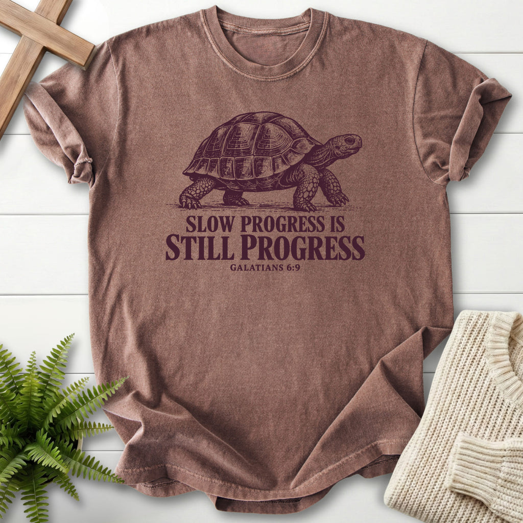 Espresso color option for the Slow Progress Is Still Progress garment-dyed Christian tee with "Slow Progress Is Still Progress T-Shirt" Galatians 6:9.