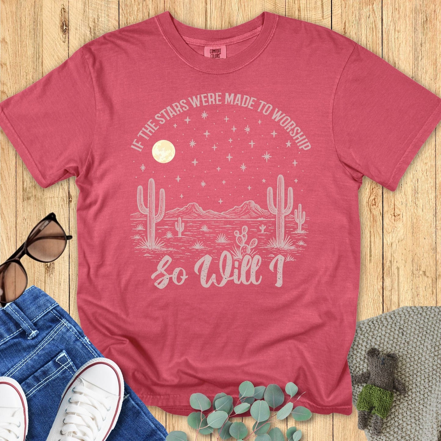 Faith-based women’s t-shirt on Comfort Colors 1717 in crimson red with celestial desert design, scripture-inspired phrase 'If the stars were made to worship so will