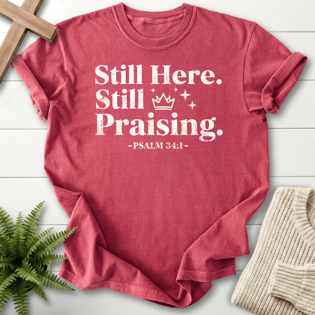 Crimson Scripture shirt with bold grunge Still Here, Still Praising design and Psalm 34:1, by She Wears Faith.