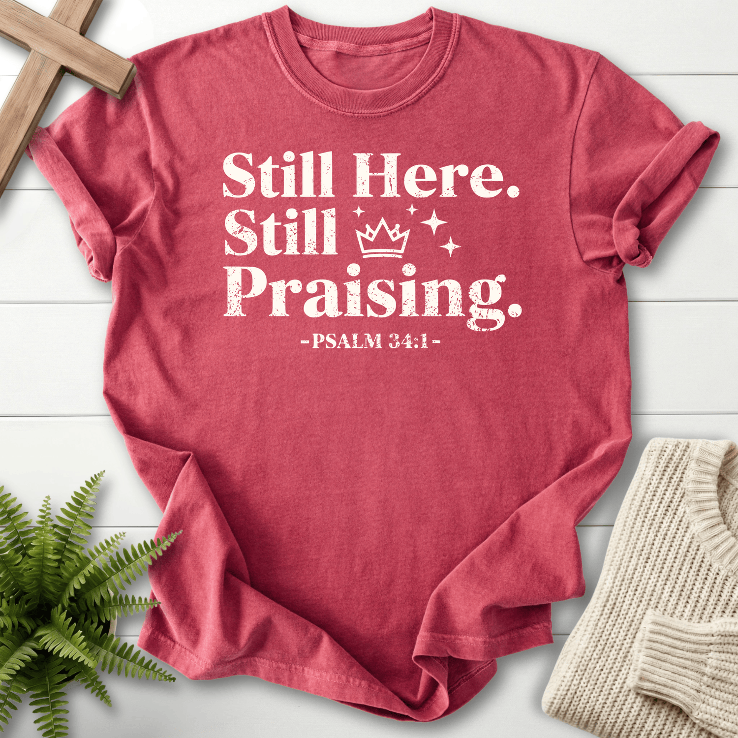 Crimson Scripture shirt with bold grunge Still Here, Still Praising design and Psalm 34:1, by She Wears Faith.