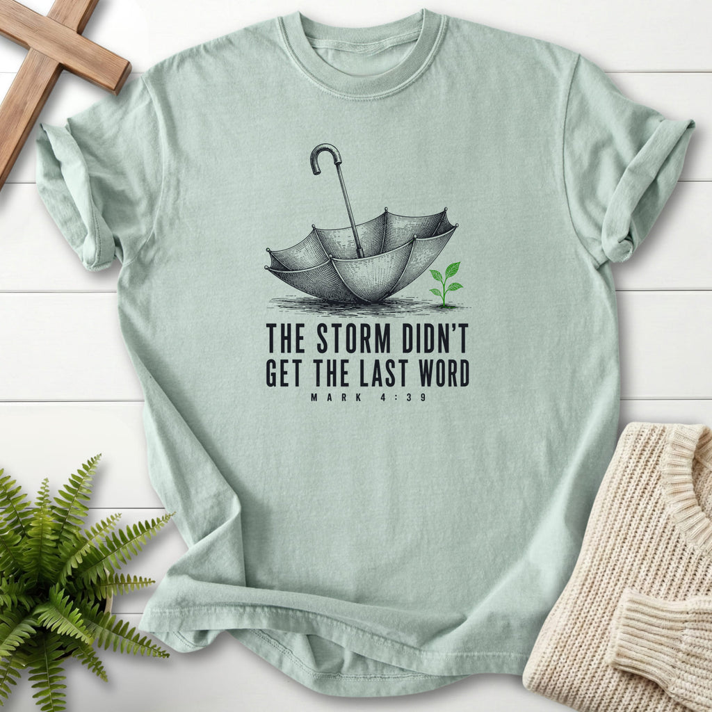 Bay color option for the Storm Didn't Get the Last Word tee with an engraved umbrella and seedling with "Storm Didn't Get the Last Word T-Shirt".