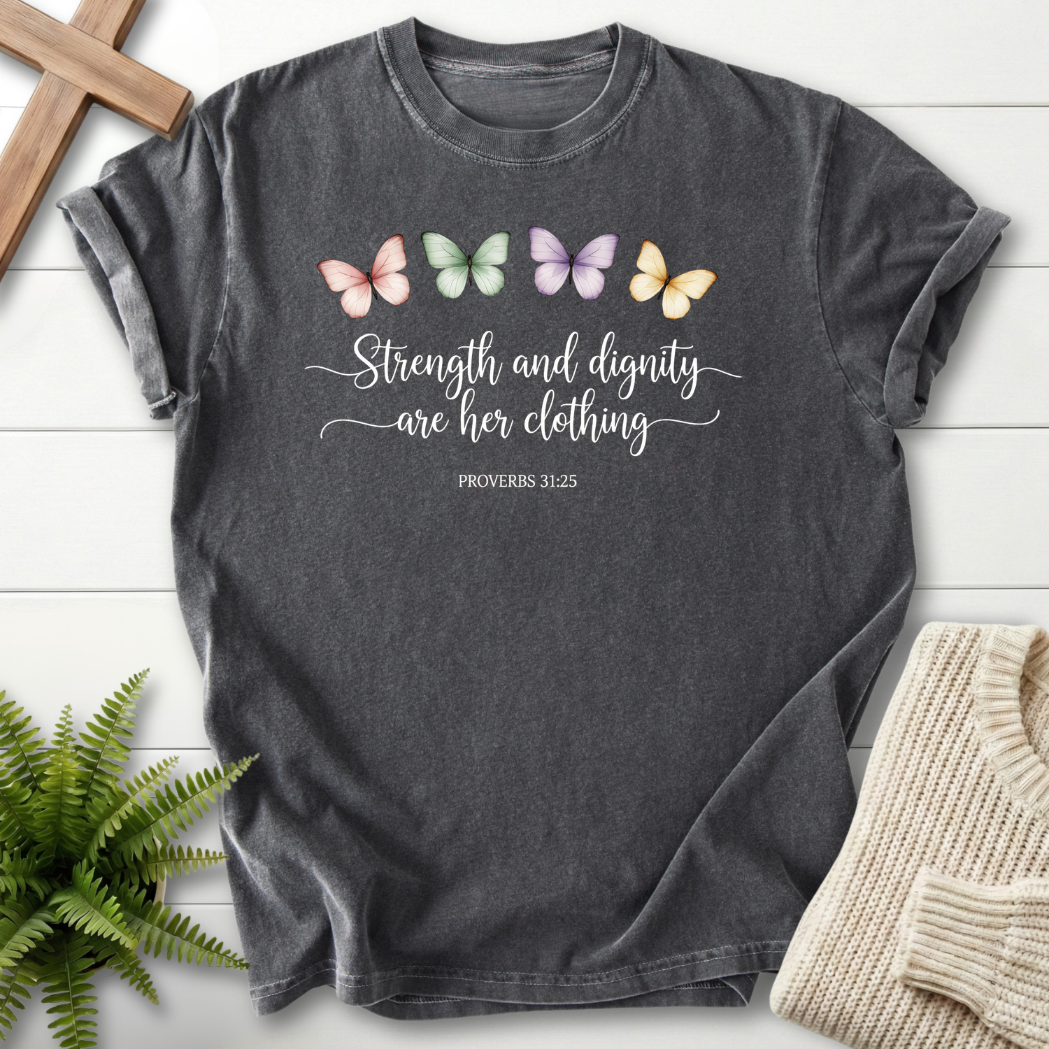 Pepper Scripture shirt with colorful watercolor butterflies and elegant Strength and Dignity cursive lettering, inspired by Proverbs 31:25.