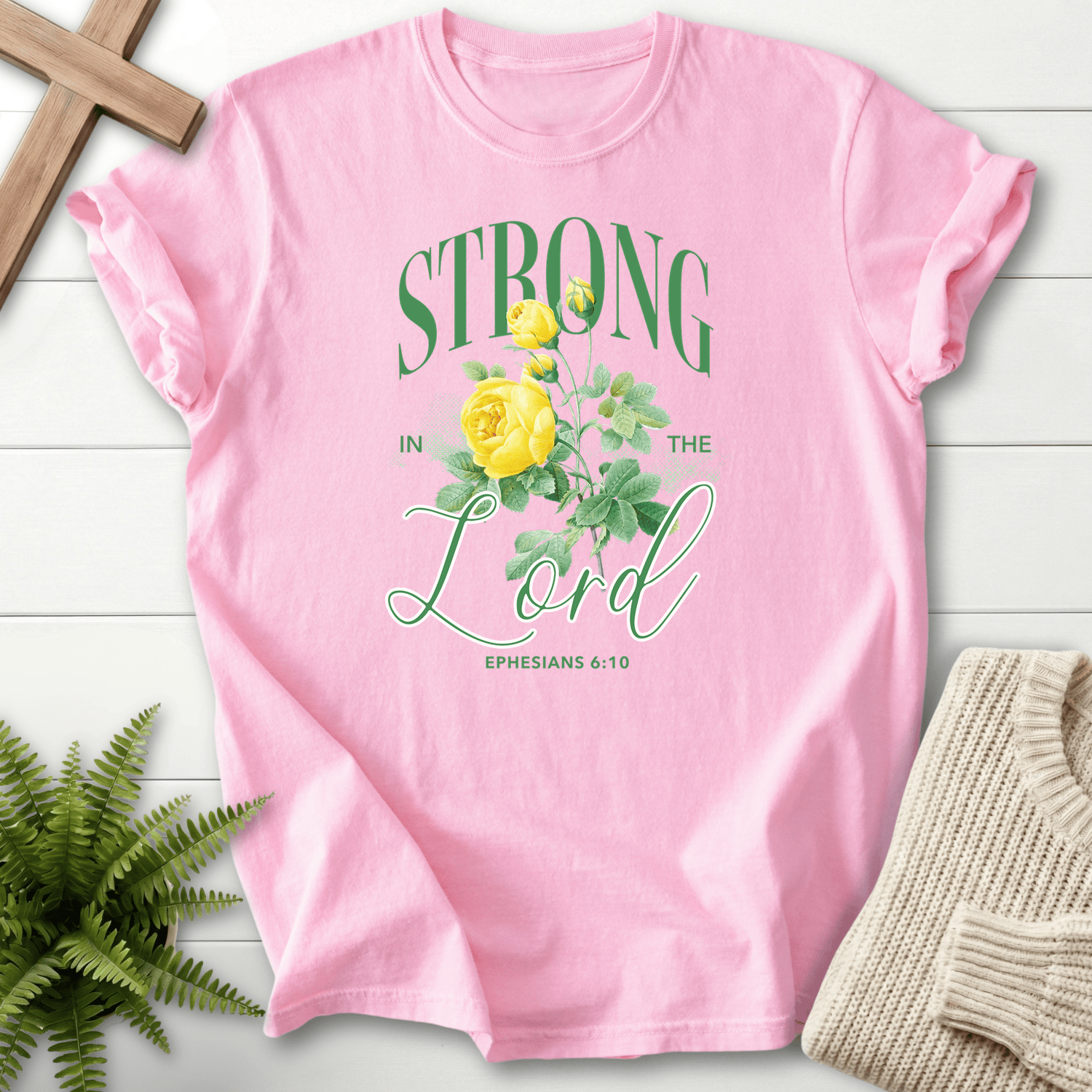 Blossom Scripture shirt with Strong in the Lord text framing a vintage yellow rose, inspired by Ephesians 6:10.
