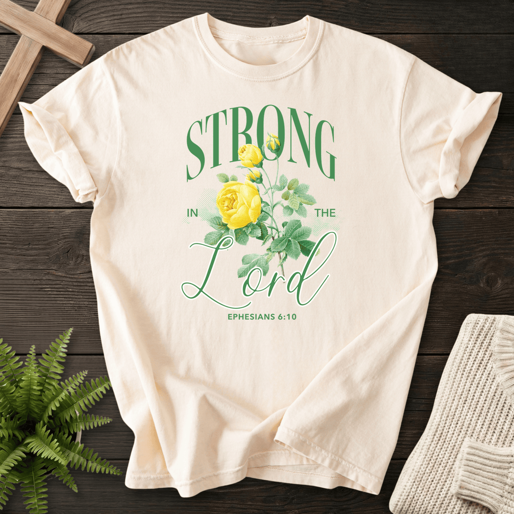 Ivory faith-based tee with Strong in the Lord, a large yellow rose, and green leaves, Comfort Colors 1717, inspired by Ephesians 6:10.