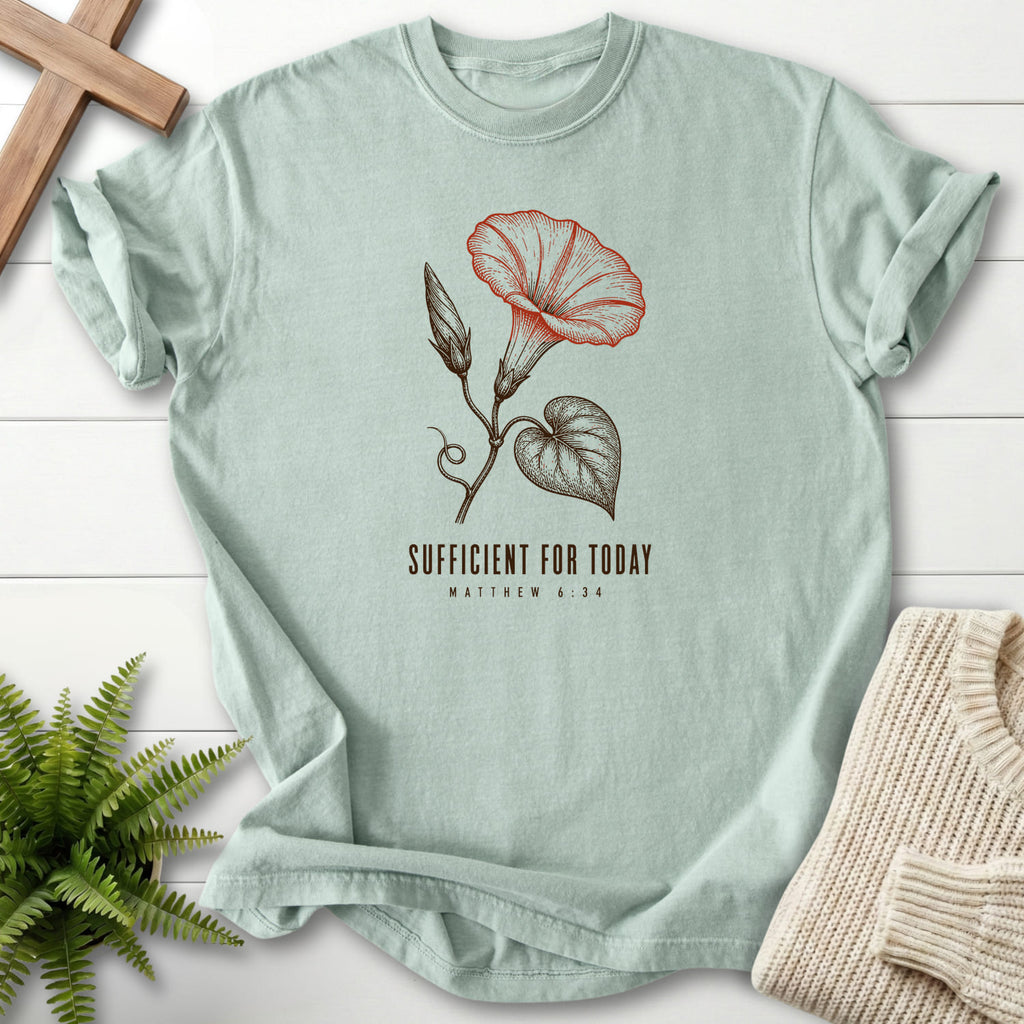 Flat lay of a Bay faith-inspired shirt featuring flower artwork with "Sufficient for Today T-Shirt".