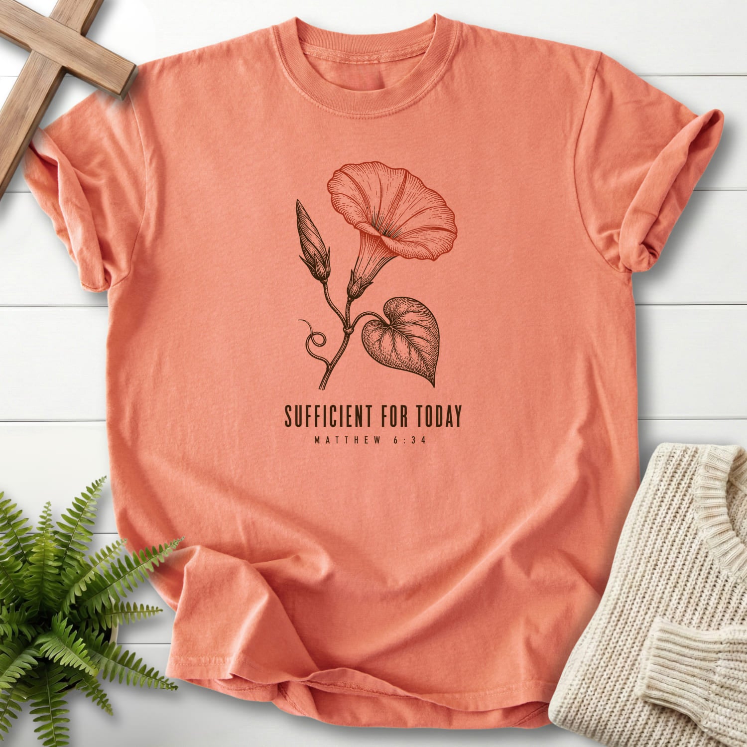 Flat lay of a Terracotta Christian graphic tee featuring flower artwork with "Sufficient for Today T-Shirt".
