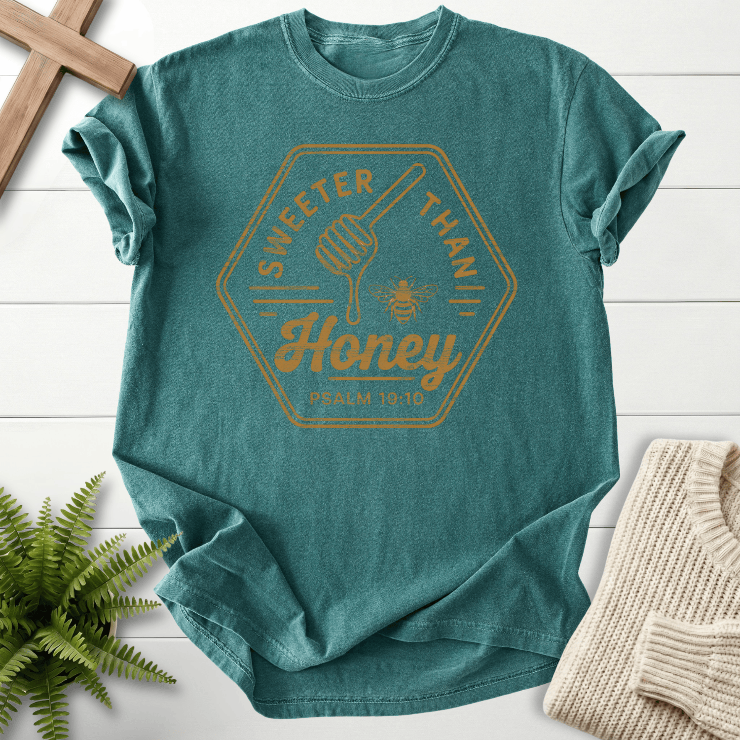 Blue Spruce Christian t-shirt for women with a honeybee badge design, by She Wears Faith, inspired by Psalm 19:10.