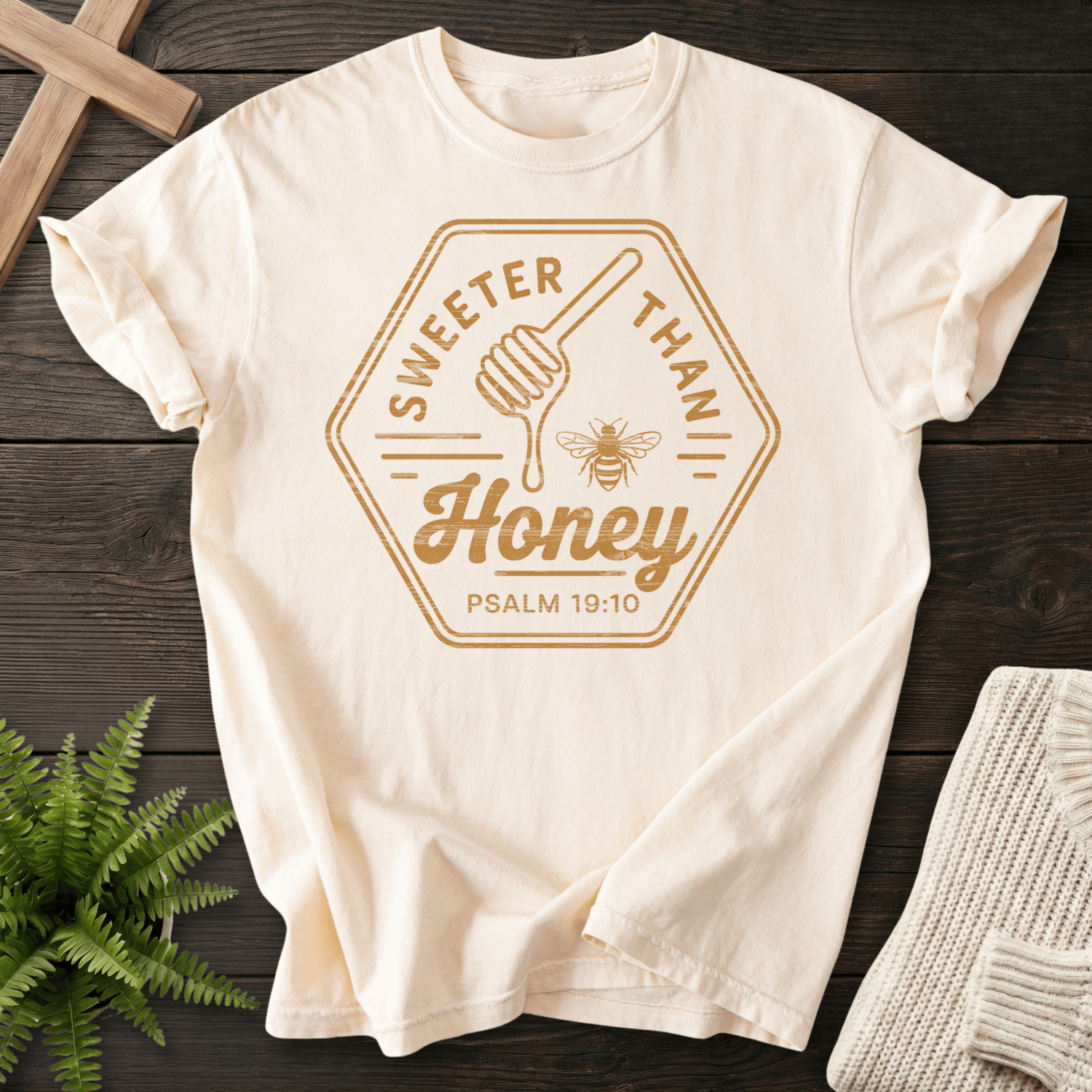 Ivory Bible verse tee with the Sweeter Than Honey badge, a honey dipper, and bee motif, inspired by Psalm 19:10.