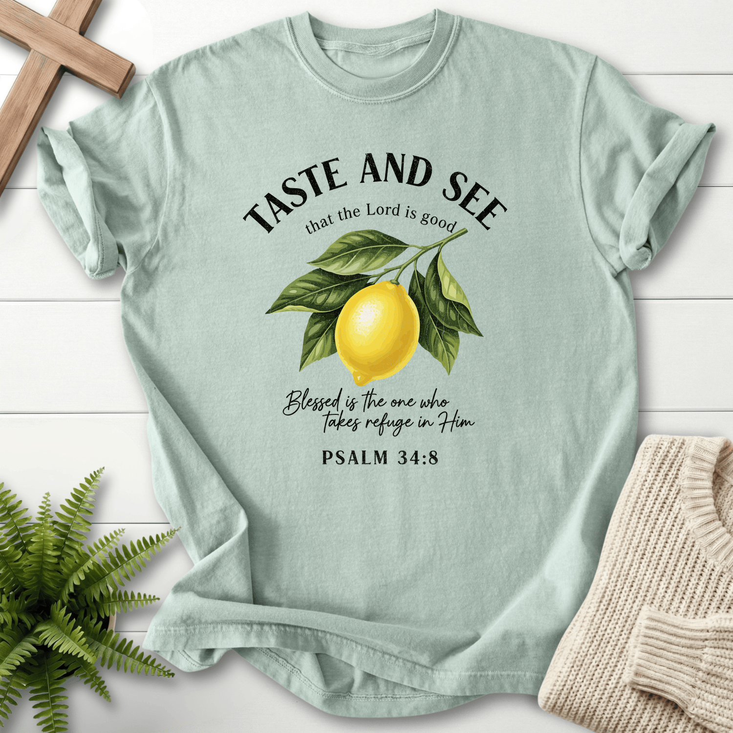 Bay faith-based tee with the Taste and See lemon design, arched text, and Psalm 34:8.