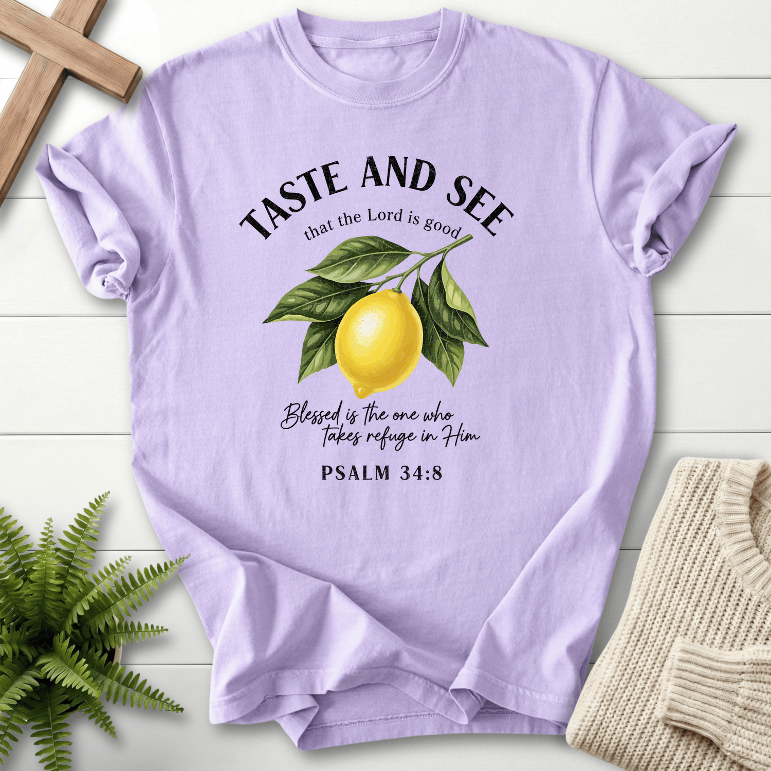 Orchid Bible verse tee with a lemon branch design and Psalm 34:8 in an elegant arched layout.