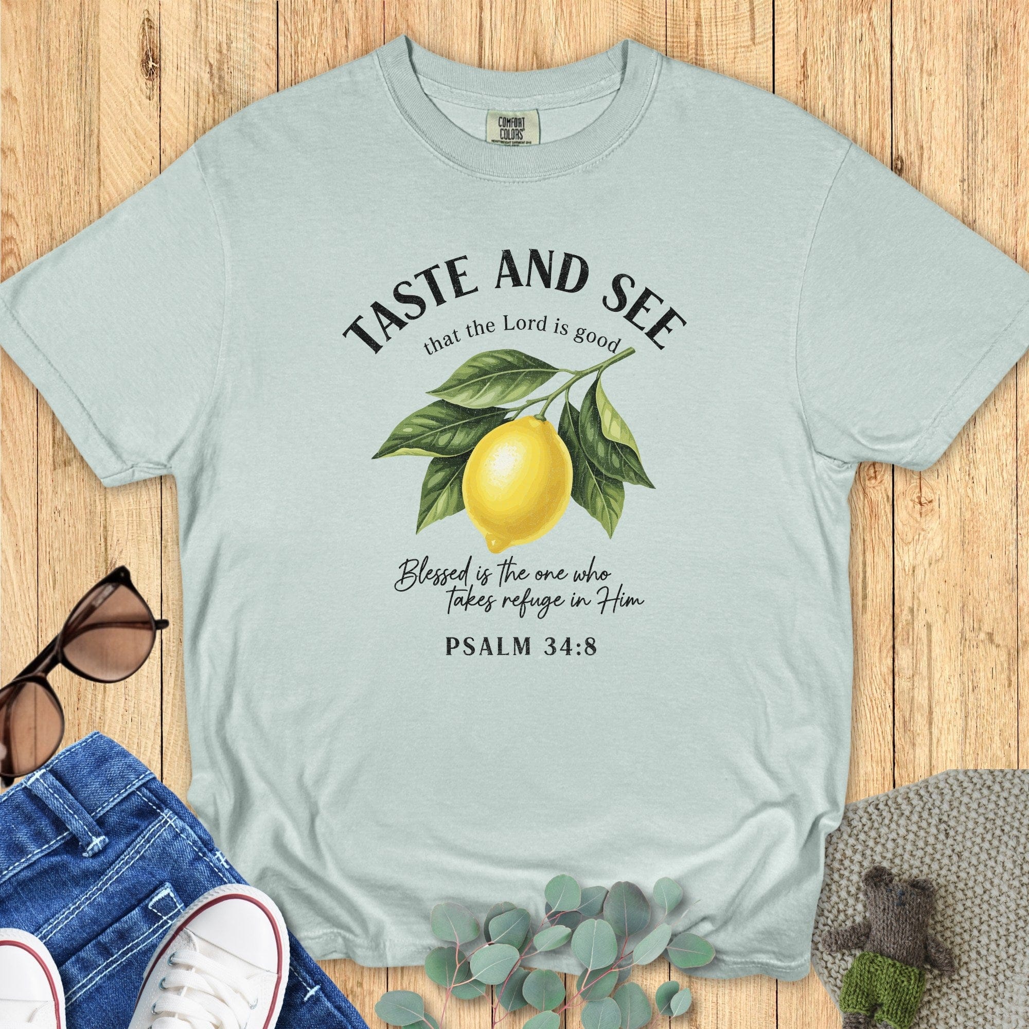 Bay Green Comfort Colors 1717 tshirt with a detailed lemon branch graphic and "Taste and See" text. Soft green Christian women tee featuring Psalm 34:8, a popular color choice for US faith wear apparel.