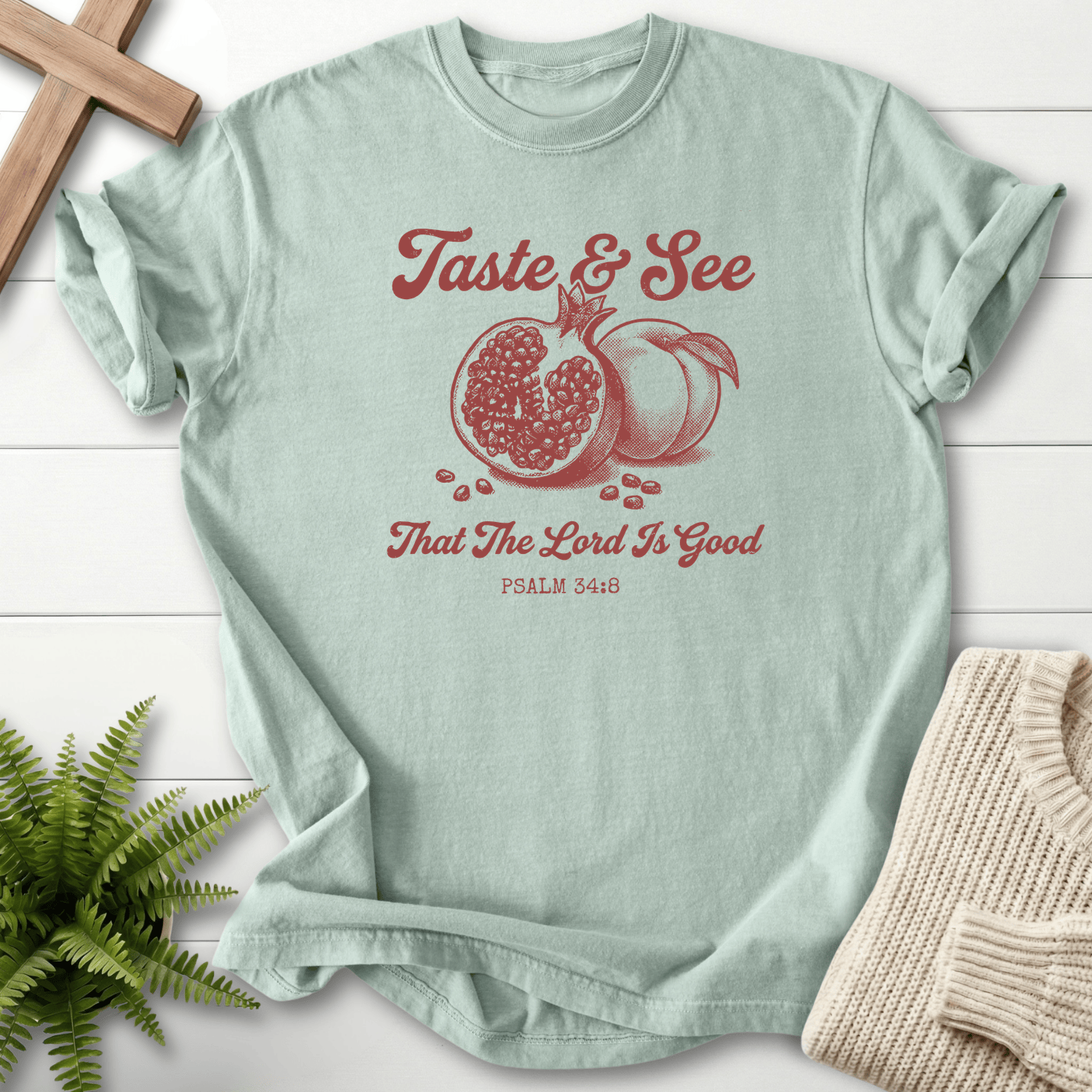 Bay Bible verse tee with a retro pomegranate motif and That the Lord Is Good text, inspired by Psalm 34:8.