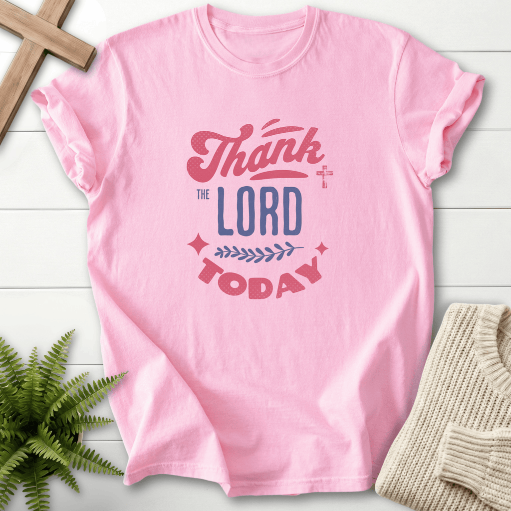 Blossom Christian t-shirt for women with layered Thank the Lord Today lettering in pink, white, and dark ink.