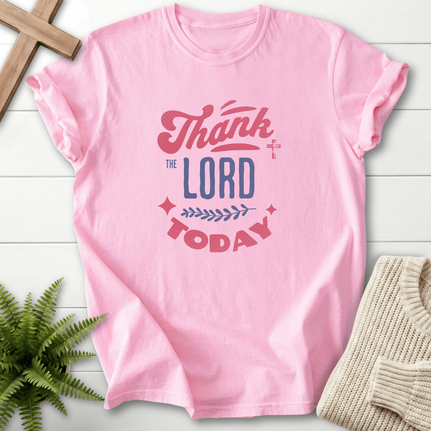 Blossom Christian t-shirt for women with layered Thank the Lord Today lettering in pink, white, and dark ink.