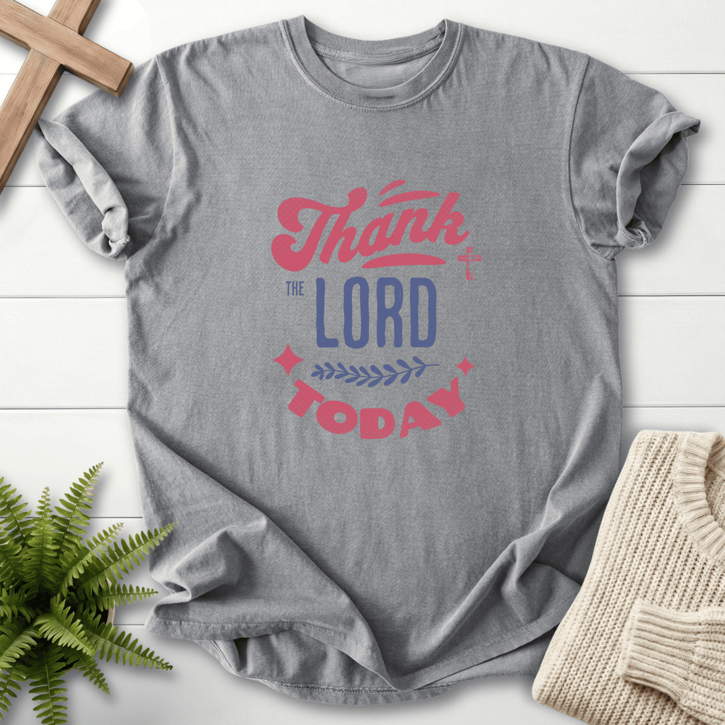 Grey faith-based tee with vintage Thank the Lord Today typography, a cross, and a leaf sprig motif.