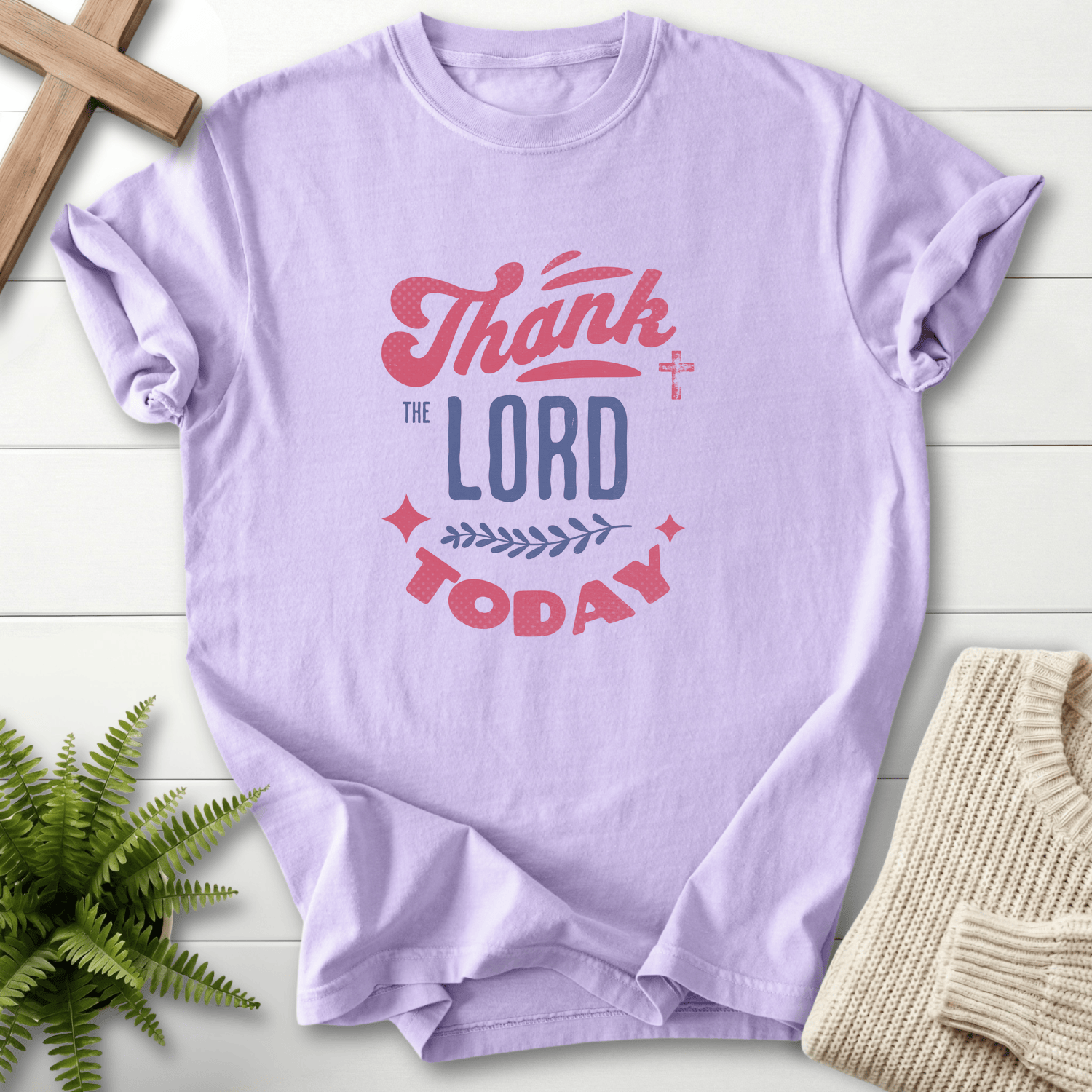 Orchid Christian t-shirt for women with Thank the Lord Today retro lettering and a decorative leaf-and-cross motif.