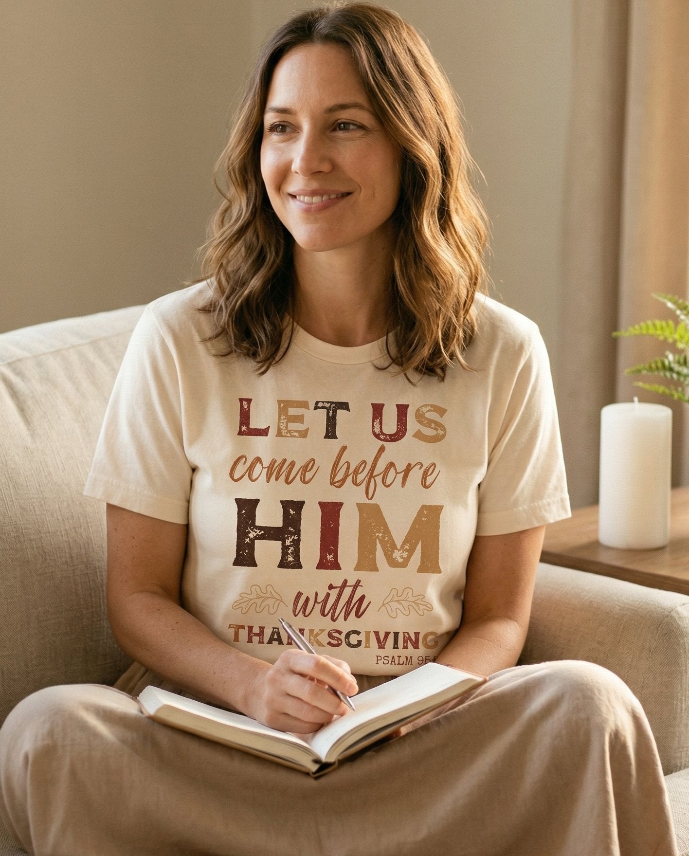 Thanksgiving Faith – Ivory women's Christian tee, lifestyle photo in cozy living room – Fall-themed distressed typography reading 'Let Us Come Before Him With – Psalm 95:2 – She Wears Faith
