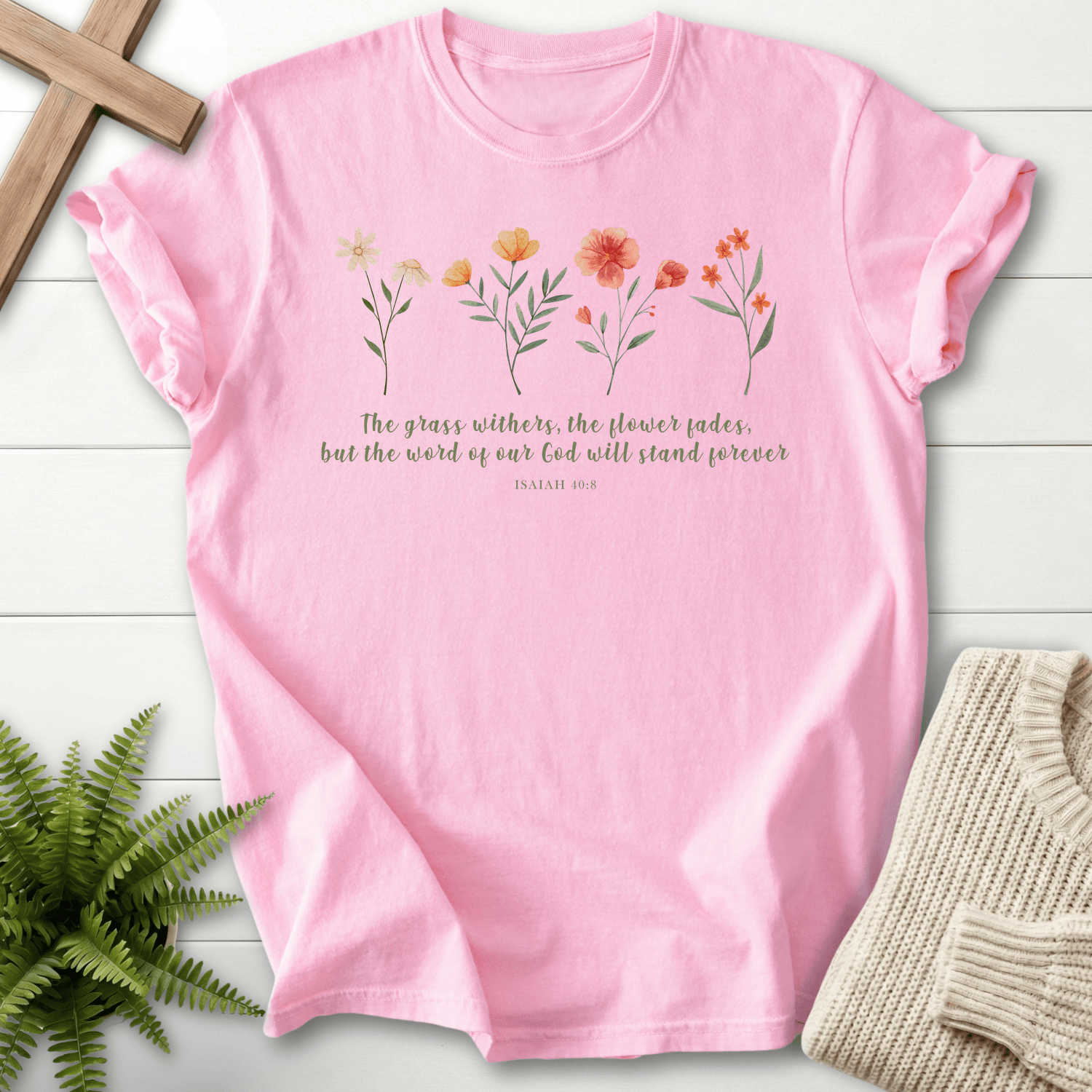 Blossom Christian t-shirt for women with watercolor blooms and italic verse text for The Grass Withers, The Flower Fades, inspired by Isaiah 40:8.