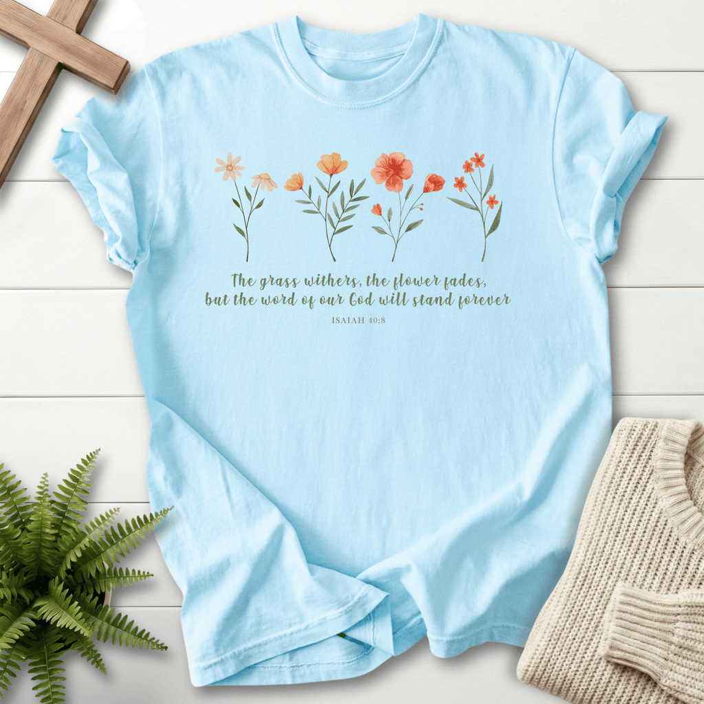 Chambray Christian t-shirt for women with the wildflower design and But the Word of Our God Stands Forever text, inspired by Isaiah 40:8.