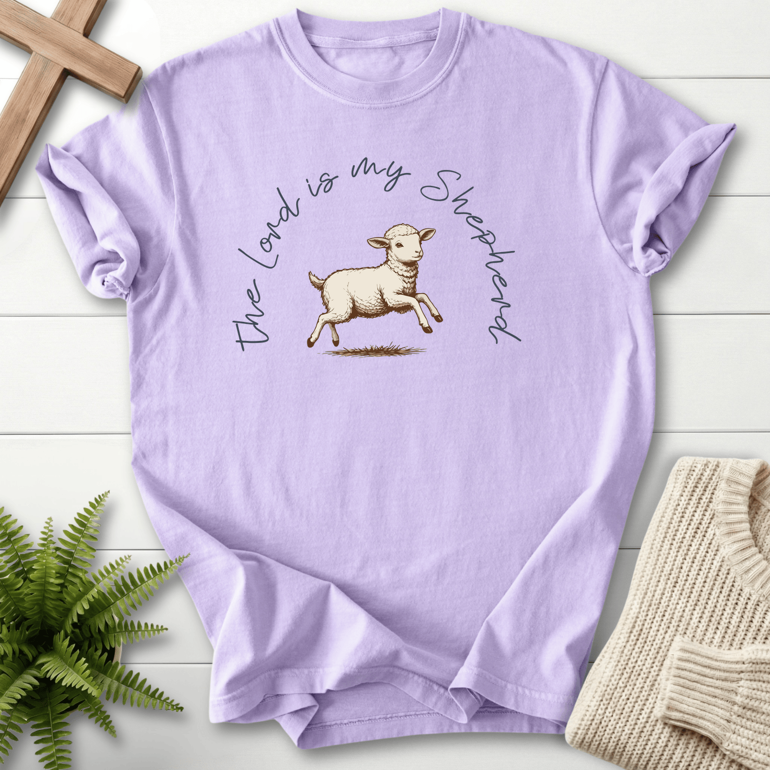 Orchid Christian t-shirt for women with a hand-drawn leaping lamb and arched cursive lettering, inspired by Psalm 23.