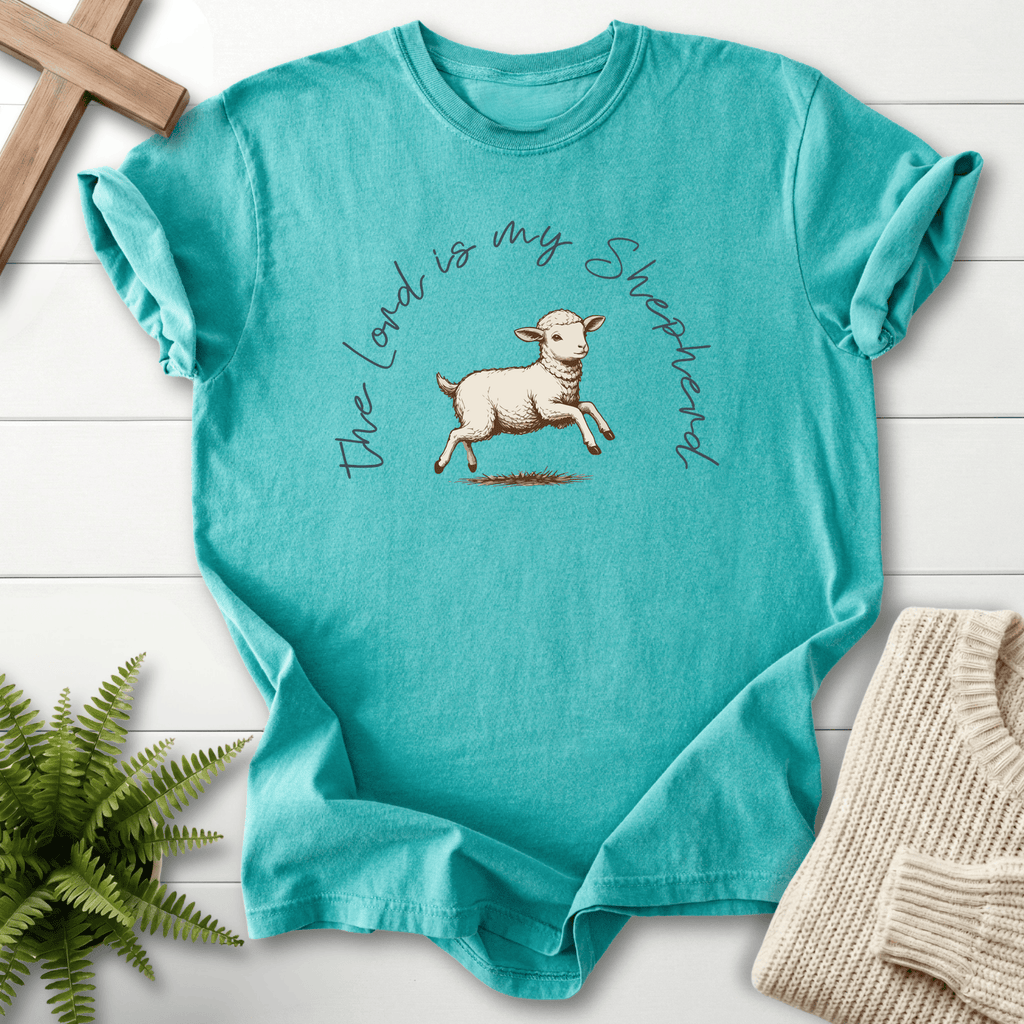 Seafoam faith-based tee with a hand-drawn leaping lamb illustration and arched cursive script, Comfort Colors 1717, inspired by Psalm 23.