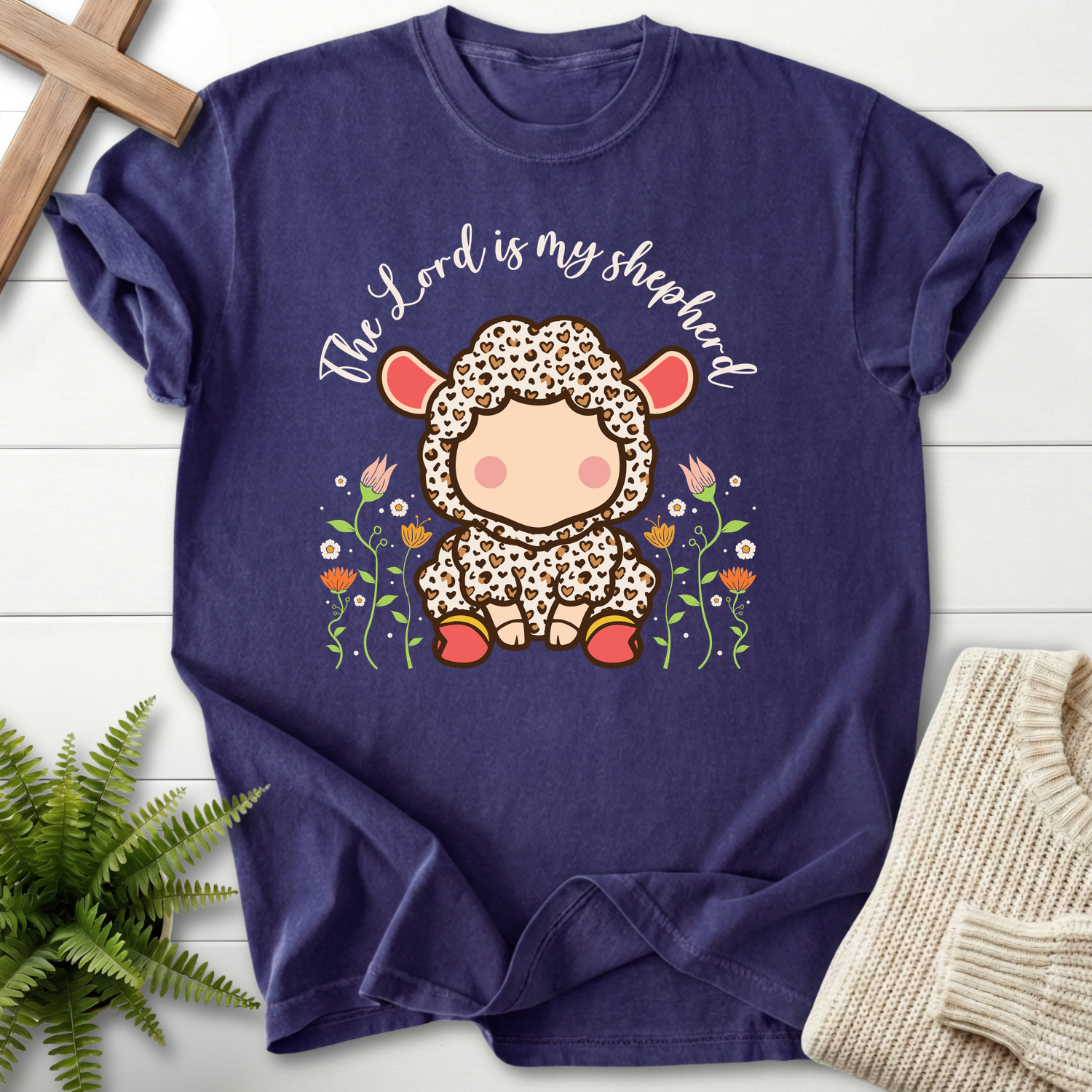 Grape Christian t-shirt for women with an adorable lamb character in a spotted outfit surrounded by pink tulip blooms, inspired by Psalm 23.