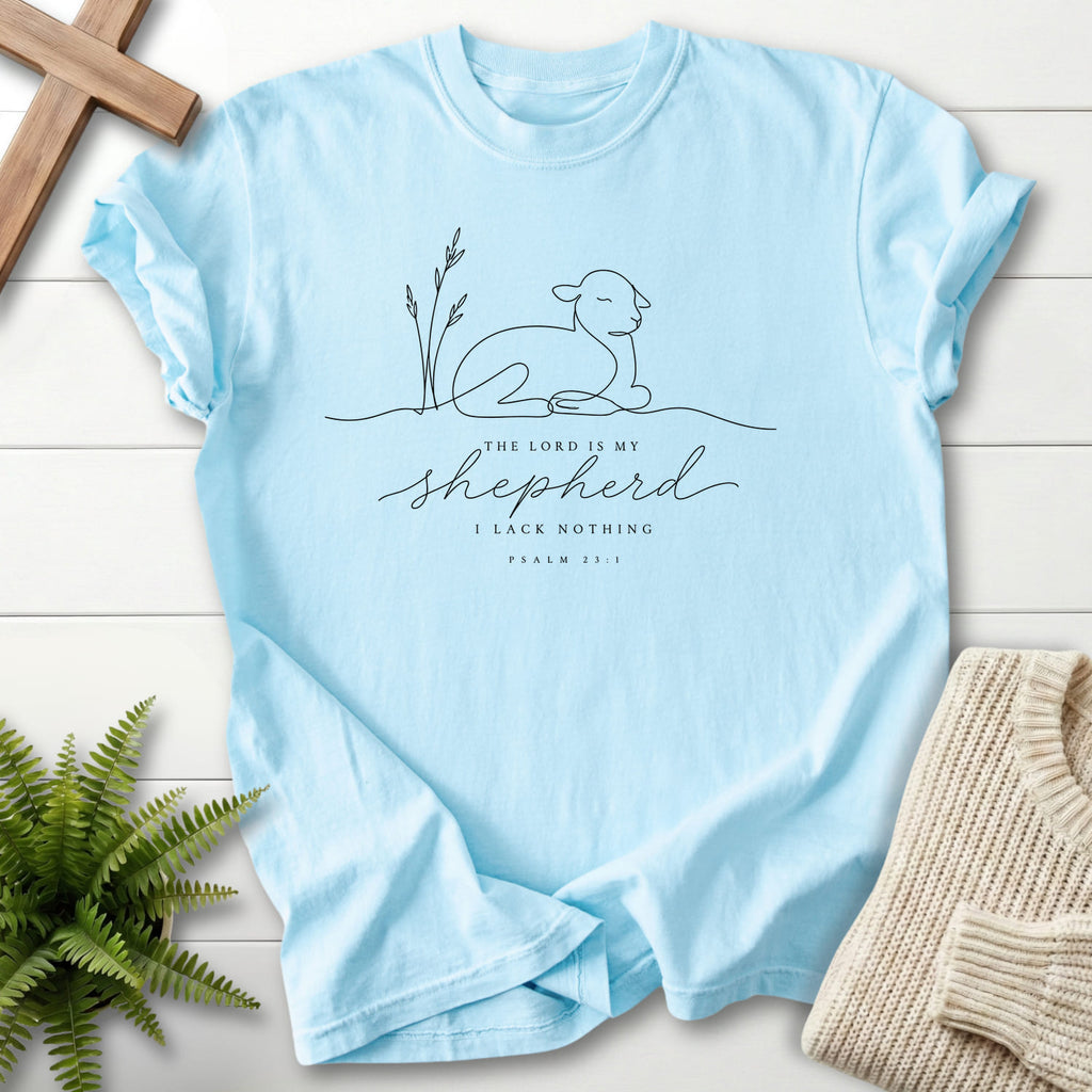 Flat lay of a Chambray Bible verse tee featuring minimalist design with "The Lord is my Shepherd Line Art T-Shirt" Psalm 23:1.