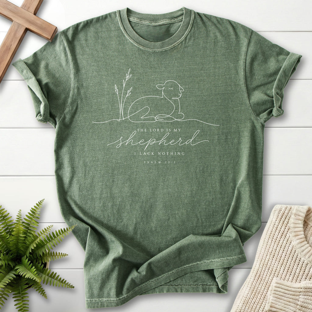 Flat lay of a Moss Christian graphic tee featuring minimalist design with "The Lord is my Shepherd Line Art T-Shirt" Psalm 23:1.