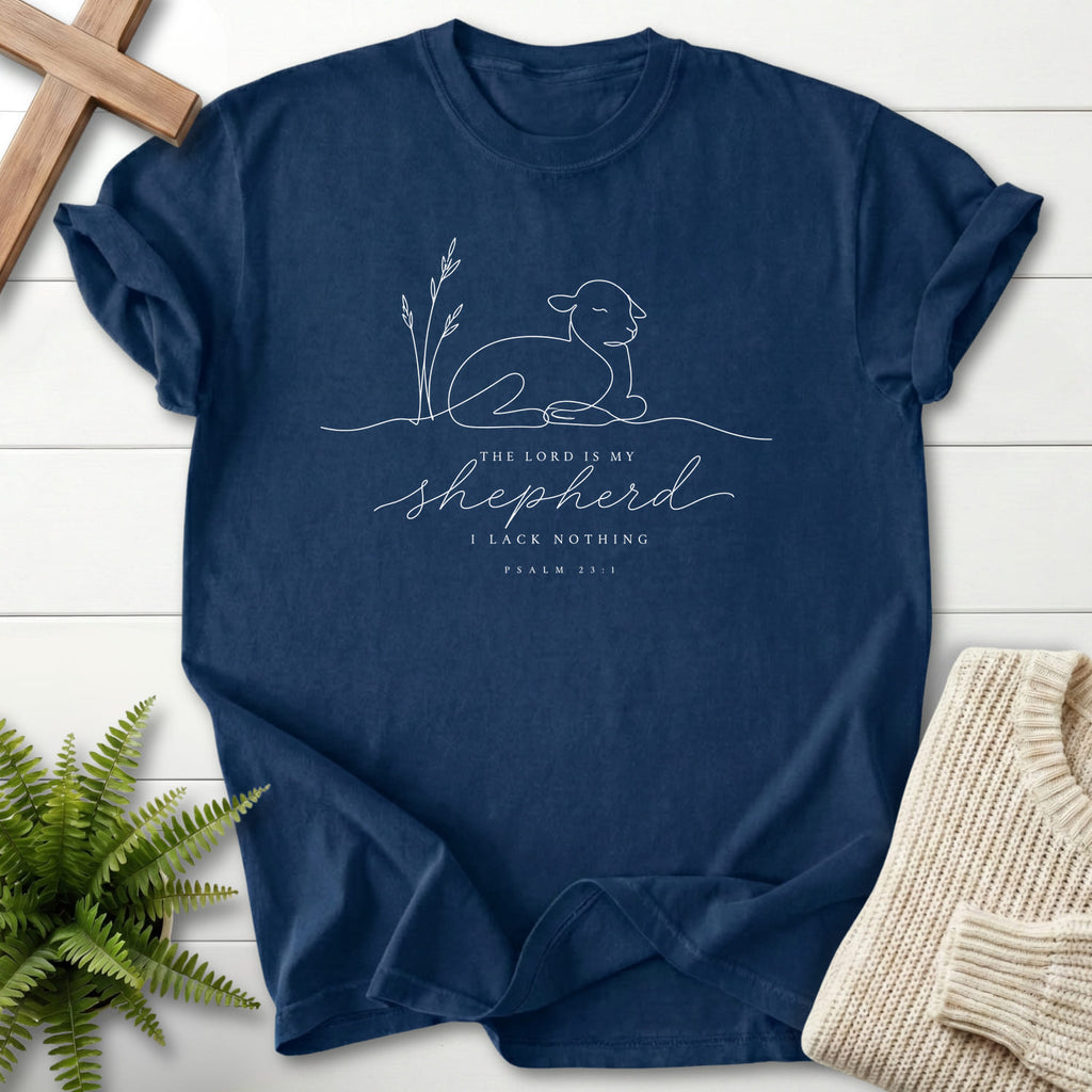 Flatlay of a Navy women's Christian tee with minimalist design with "The Lord is my Shepherd Line Art T-Shirt" Psalm 23:1.