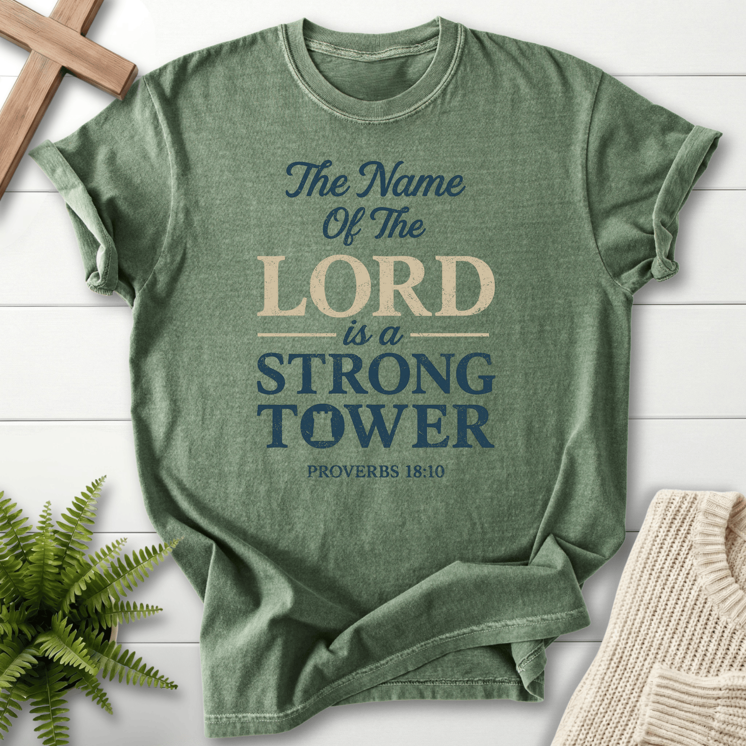 Moss Christian t-shirt for women with layered Strong Tower typography and a tower icon, inspired by Proverbs 18:10.