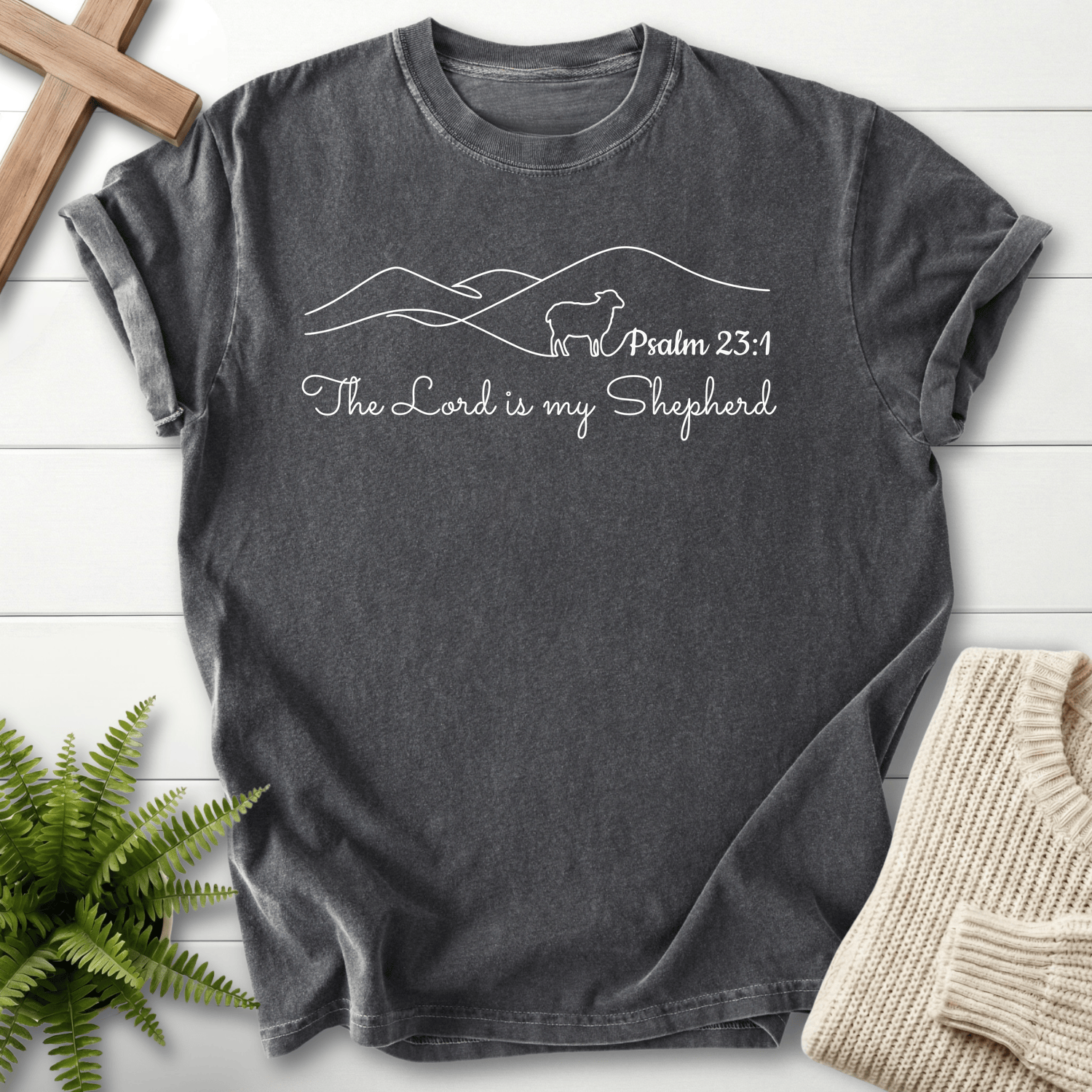 Pepper faith-based tee with a minimalist line-art shepherd scene, inspired by Psalm 23:1.