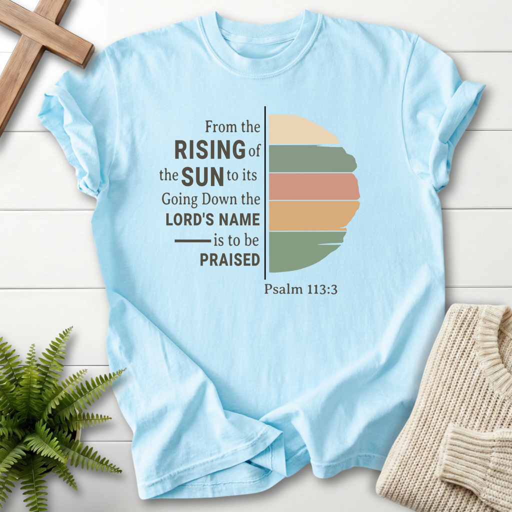 Chambray Christian t-shirt for women with a color-blocked sun illustration and 'From the Rising of the Sun', by She Wears Faith, Psalm 113:3.