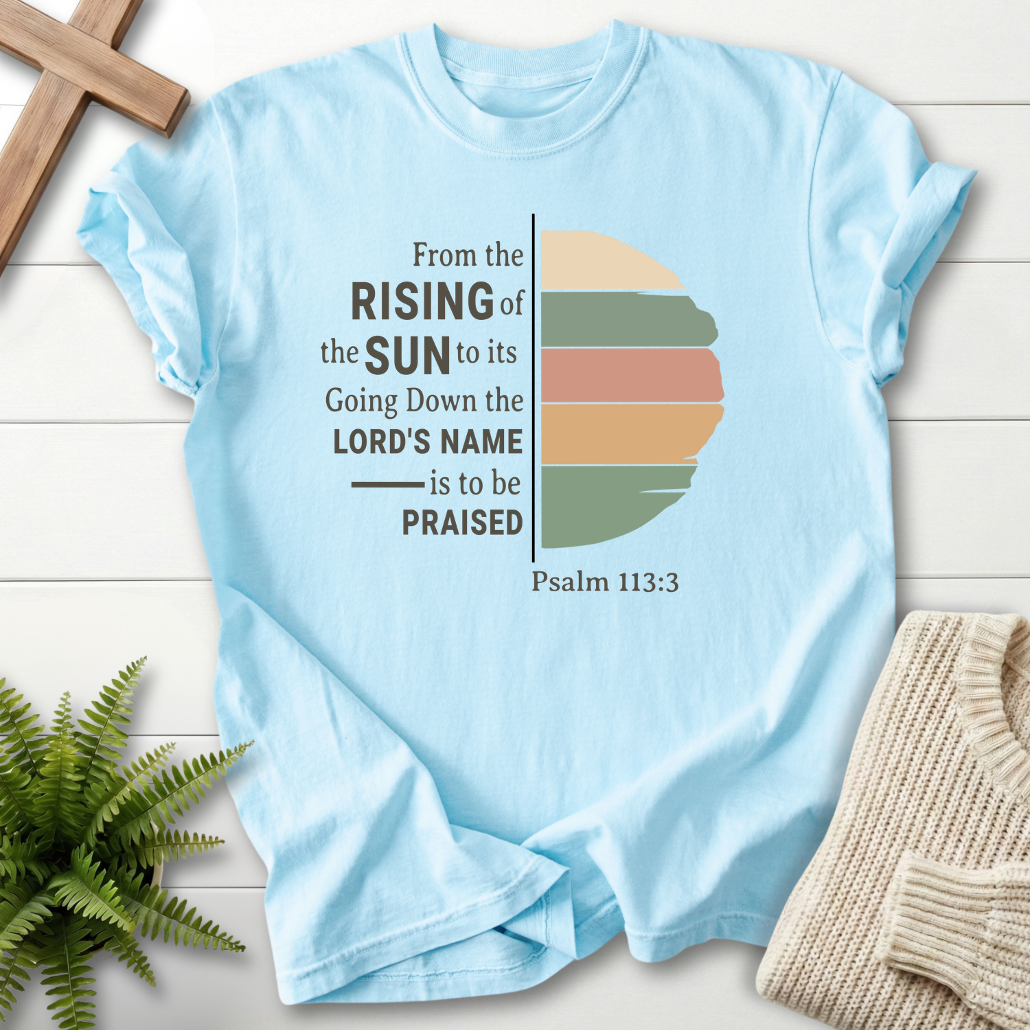 Chambray Christian t-shirt for women with a color-blocked sun illustration and 'From the Rising of the Sun', by She Wears Faith, Psalm 113:3.