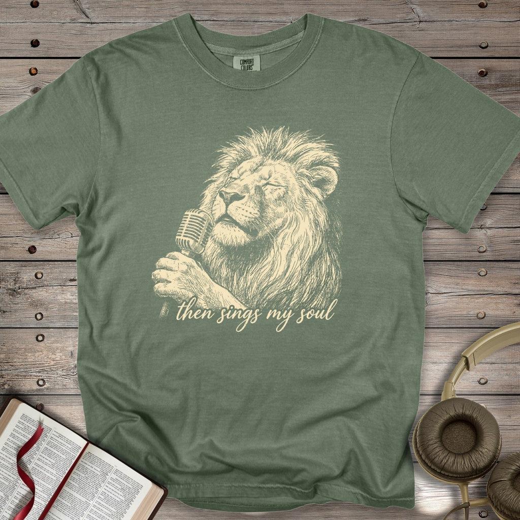 Moss Green Comfort Colors 1717 tshirt featuring a retro illustration of a lion singing praise. A soft, garment-dyed Christian women tee with the inspirational phrase "Then Sings My Soul," a staple for US faith wear.