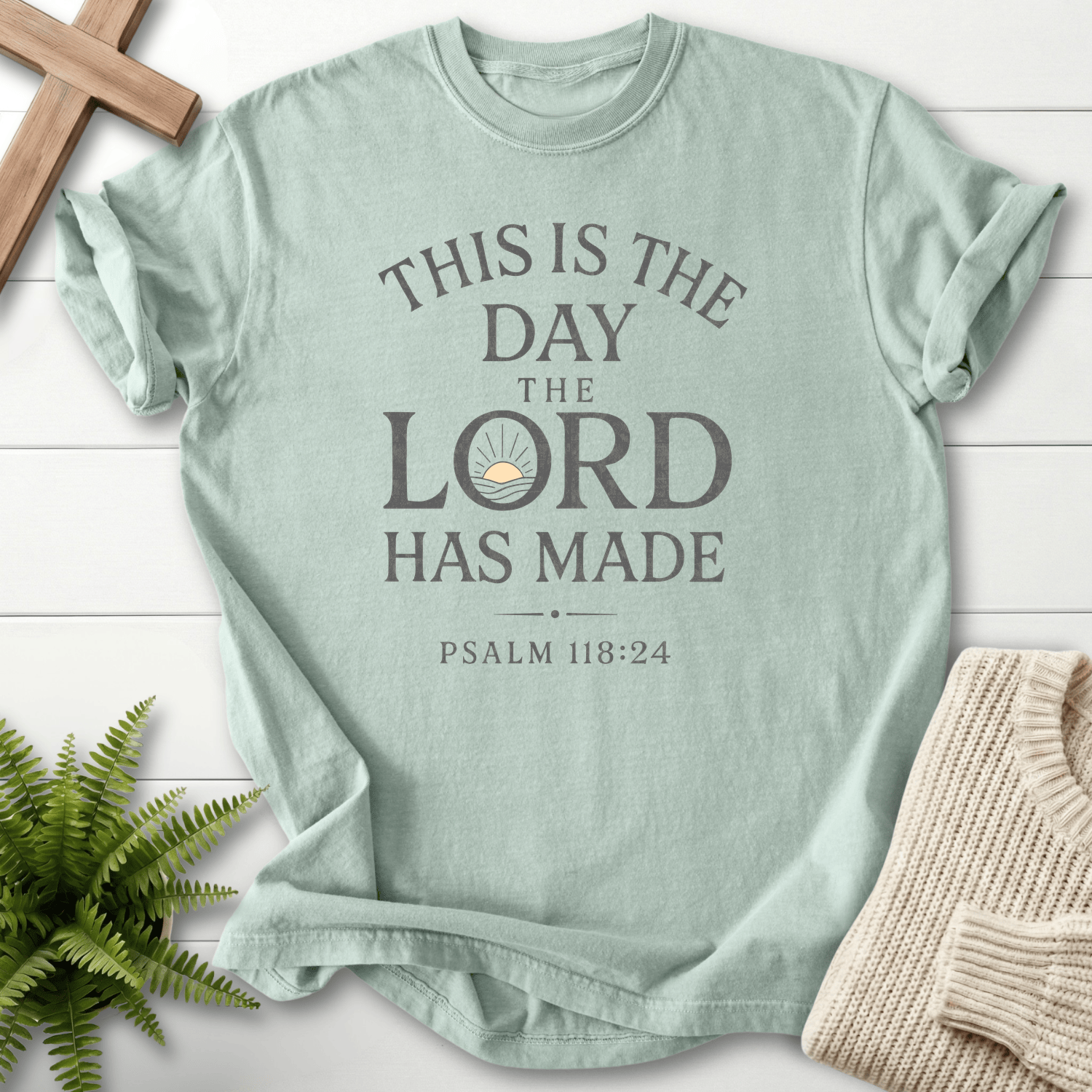 Bay faith-based tee with bold stacked This Is the Day the Lord Has Made lettering and a sunrise motif, Comfort Colors 1717, inspired by Psalm 118:24.