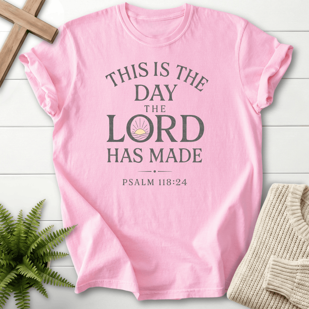 Blossom Christian t-shirt for women with a sunrise icon and bold stacked This Is the Day the Lord Has Made text, inspired by Psalm 118:24.
