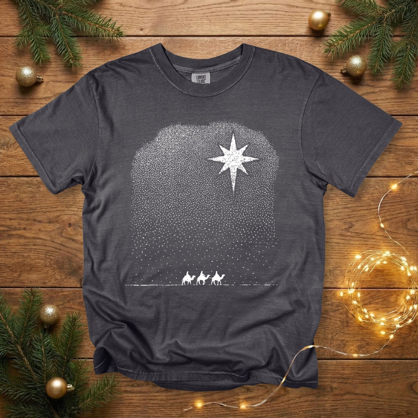 Comfort Colors 1717 pepper grey Christian women’s T-shirt featuring a minimalist Christmas design of the Star of Bethlehem shining over the Three Wise Men, created with white stippled dot artwork. A soft vintage-style US faith wear tee perfect for Christian Christmas outfits.