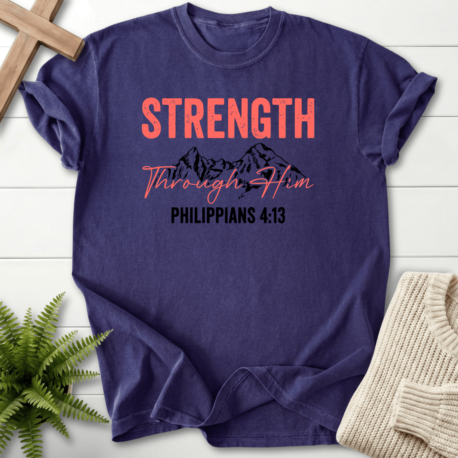 Grape Christian t-shirt for women with Strength Through Him mountain design and coral-and-black lettering, inspired by Philippians 4:13.