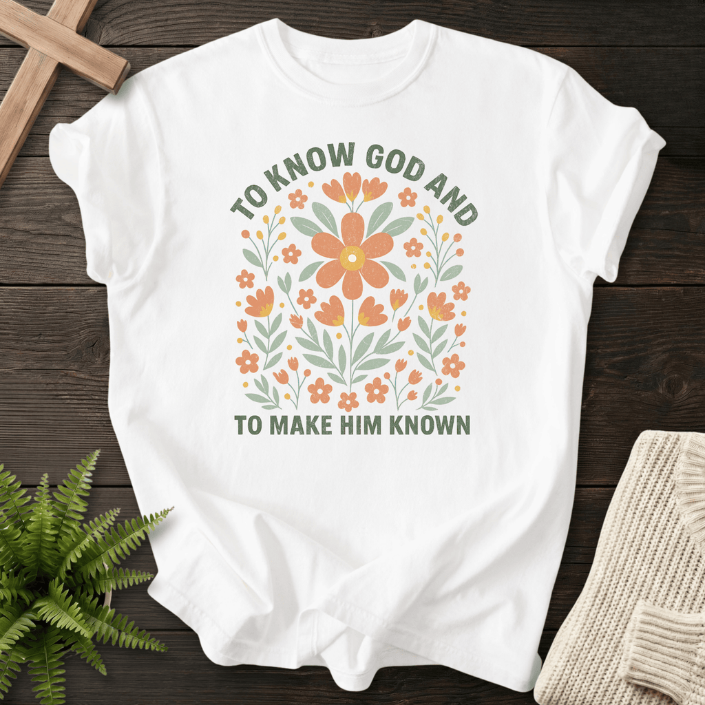 White Christian t-shirt for women with colorful wildflower botanicals and arched To Know God And To Make Him Known text.