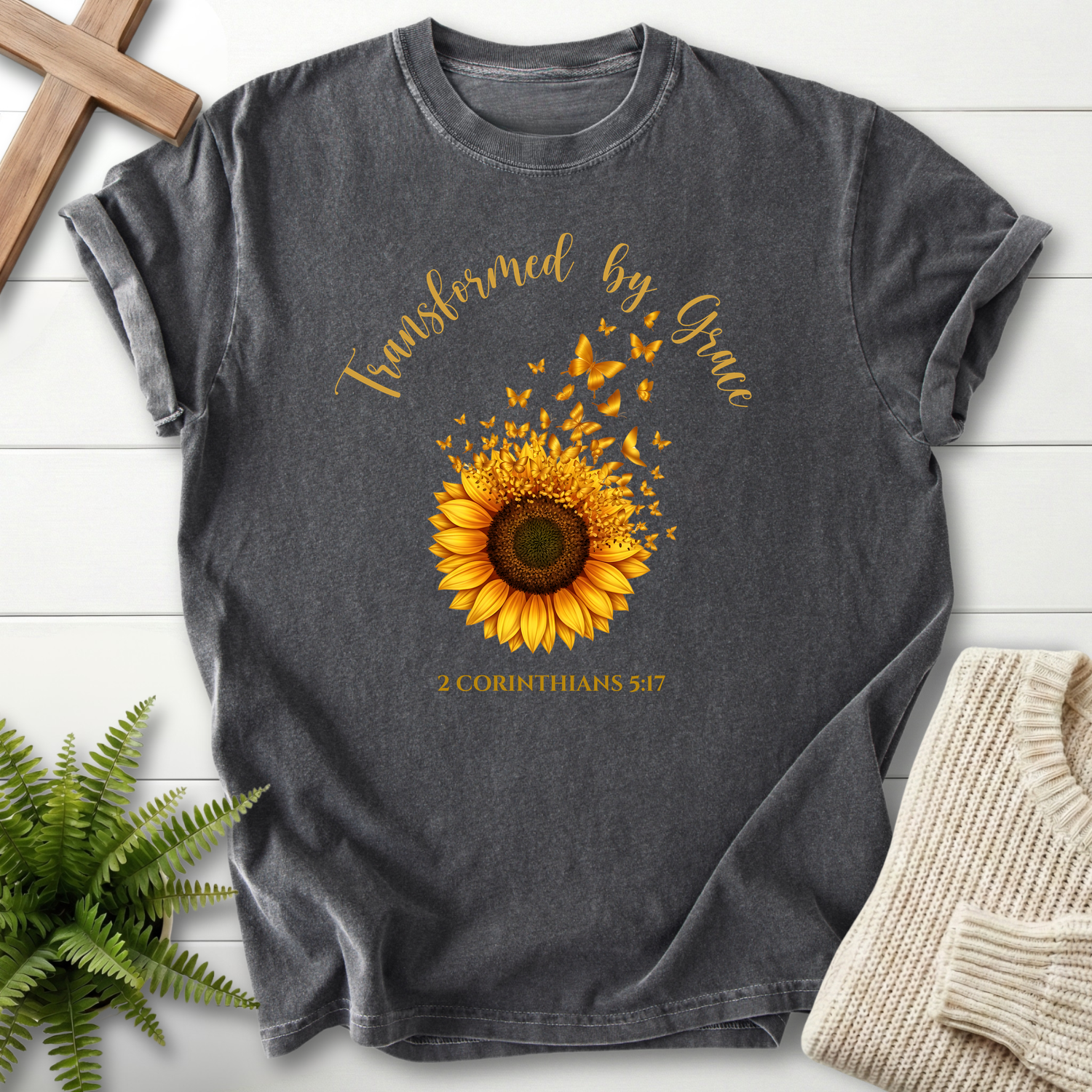 Pepper Bible verse tee with sunflower and butterfly art, by She Wears Faith, inspired by 2 Corinthians 5:17.