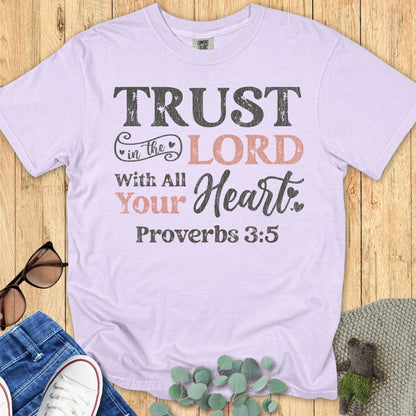 Comfort Colors 1717 orchid “Trust in the Lord with all your heart – Proverbs 3:5” t-shirt featuring warm blush and black distressed lettering. A feminine and inspiring women’s scripture tee — faith-based apparel for women and thoughtful Christian gift idea for moms.