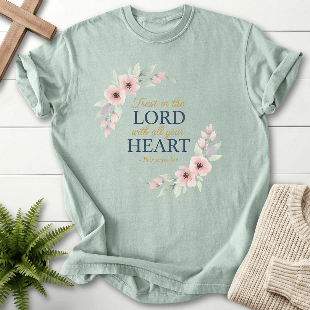 Bay faith-based tee with a pink and sage floral wreath around Trust in the Lord With All Your Heart, Comfort Colors 1717, inspired by Proverbs 3:5.