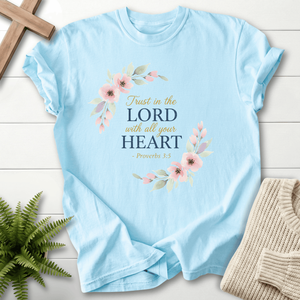 Chambray Christian t-shirt for women with a pink flower and leaf wreath and Trust in the Lord With All Your Heart text, by She Wears Faith.